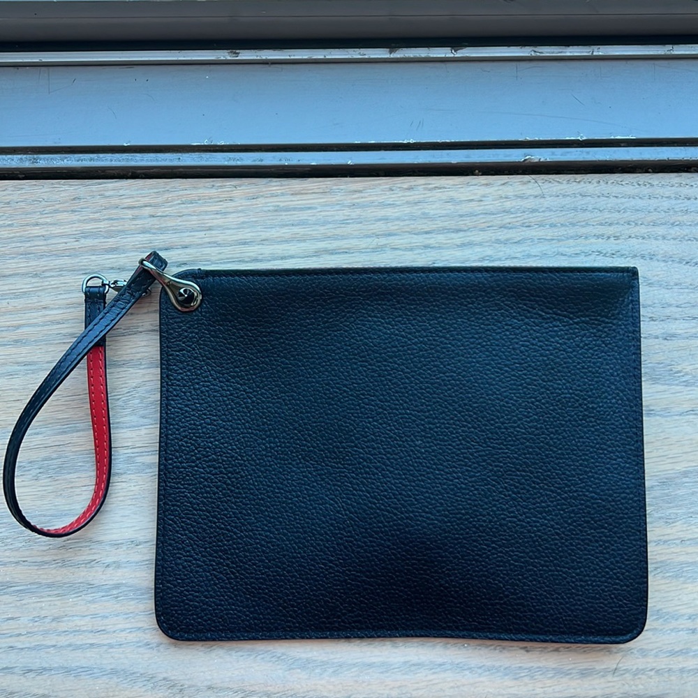 Christian Louboutin wrist bag.